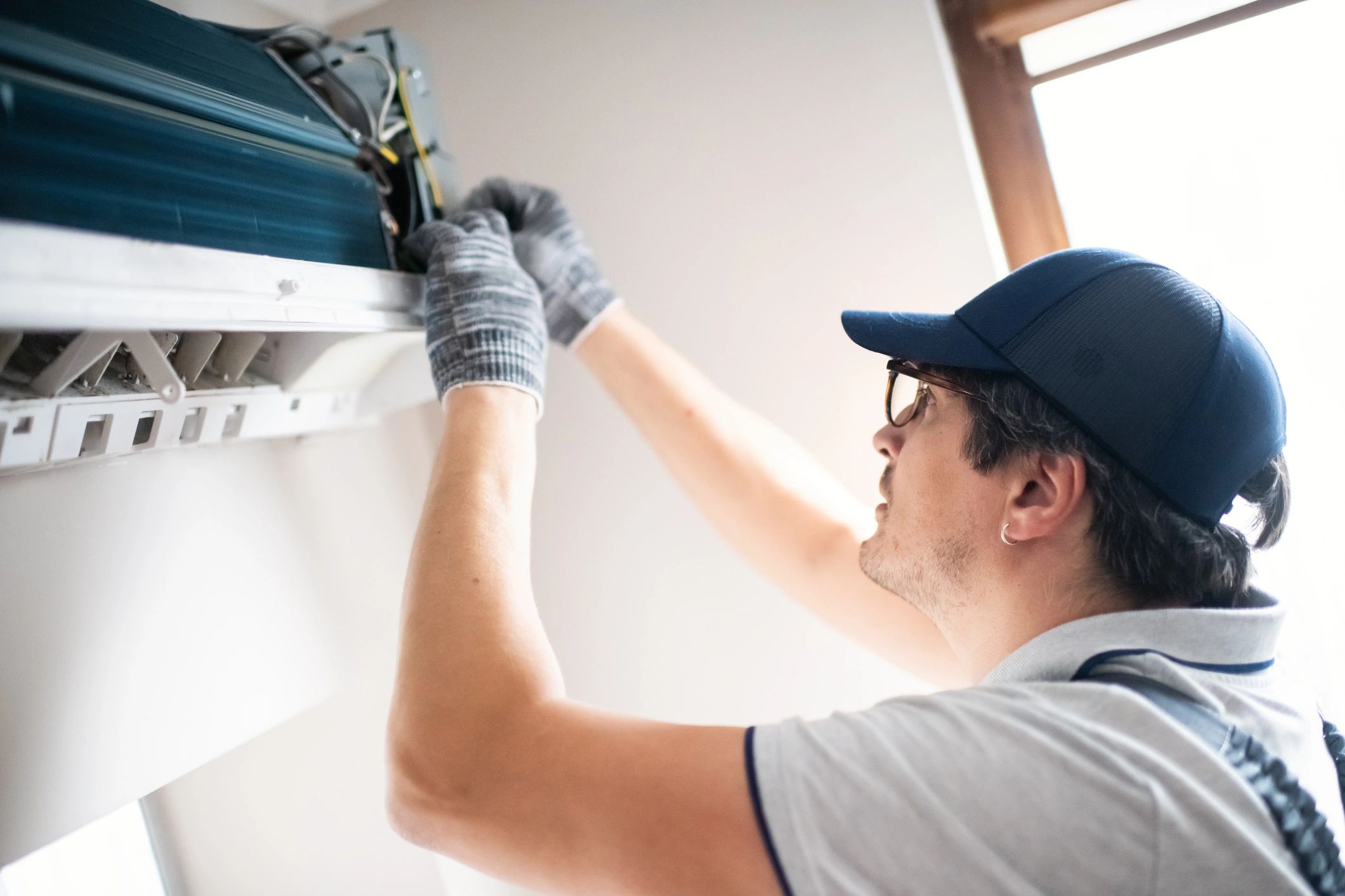 modern HVAC technician working on residential and commercial units